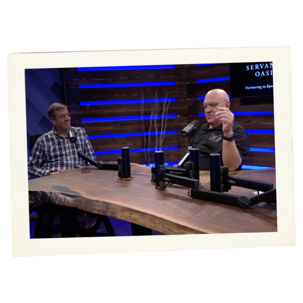 Roy Smith speaking with a guest on the LiveUp Podcast.